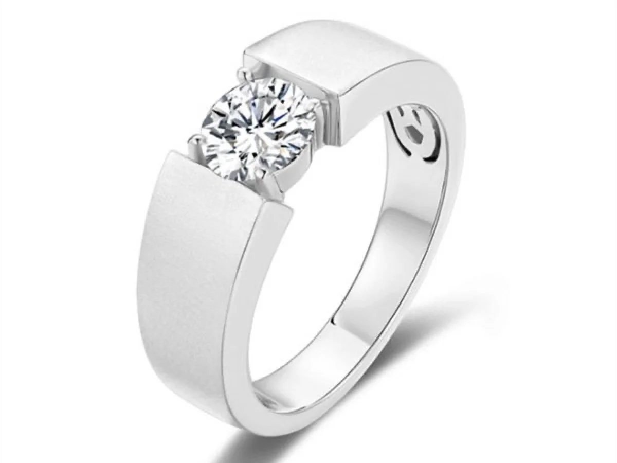 Bezel-set engagement ring in a low-profile build, manufactured by Vesta Jewelry