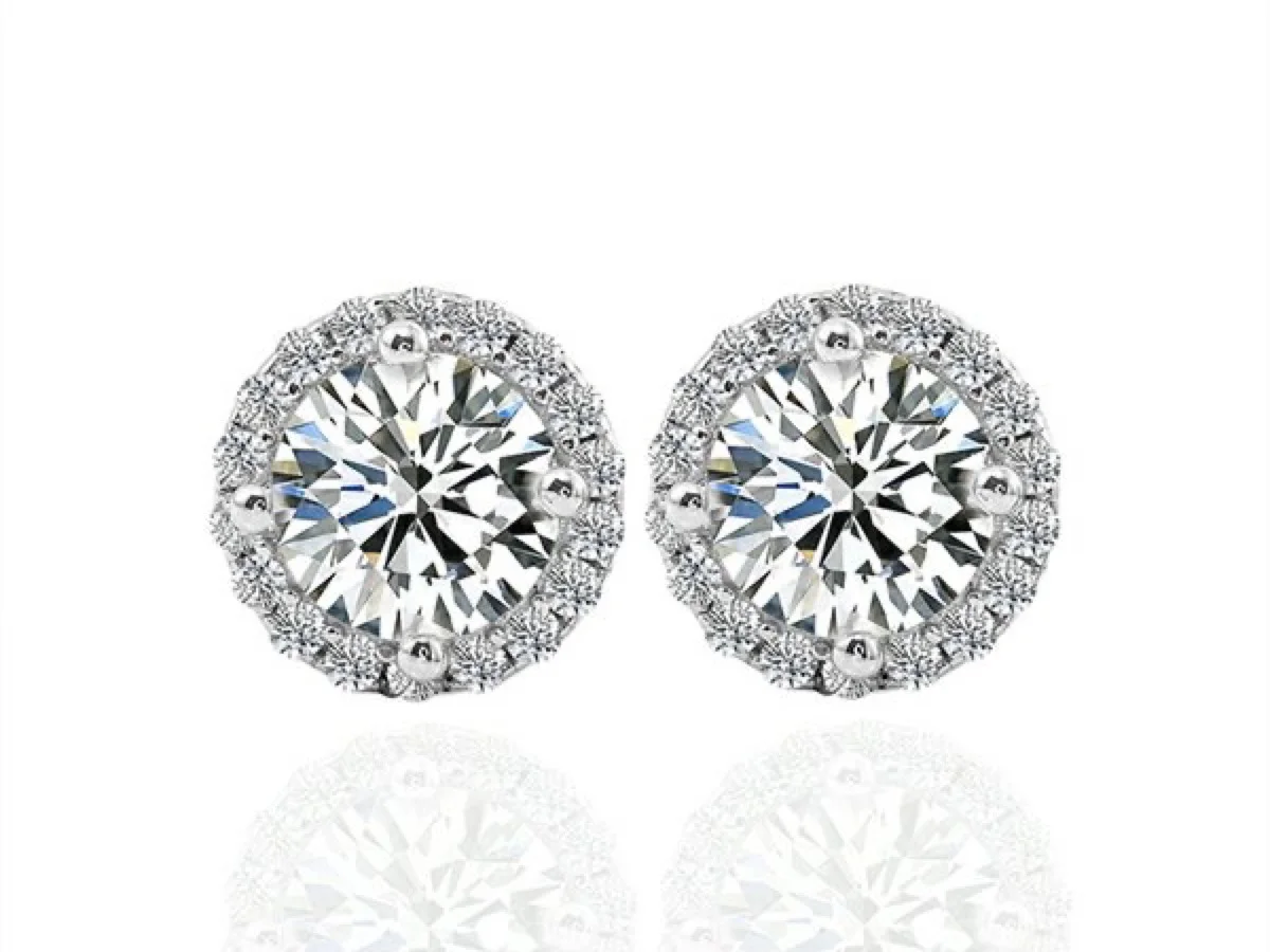 Cluster and illusion-set earrings, manufactured by Vesta Jewelry